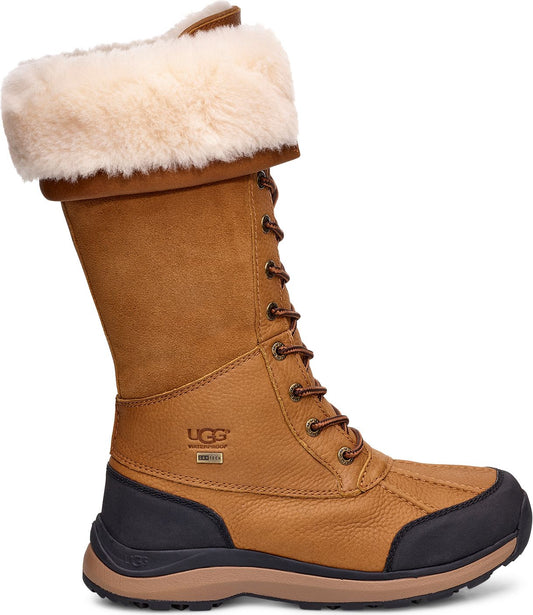 High tan boot with brown laces, faux fur collar, and UGG logo.