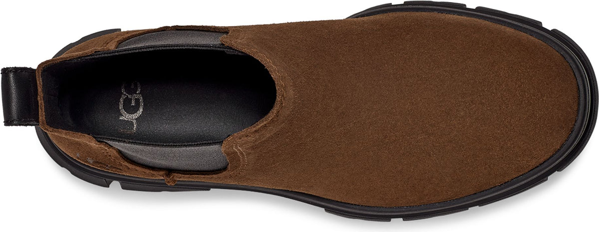 A top-down view of a brown suede Chelsea boot with black accents.