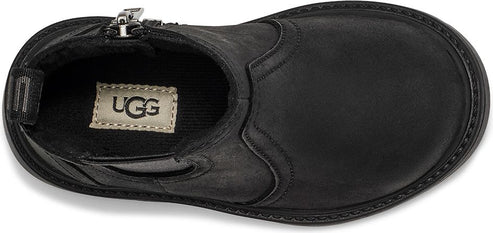 An overhead shot of a black shoe with a zipper.