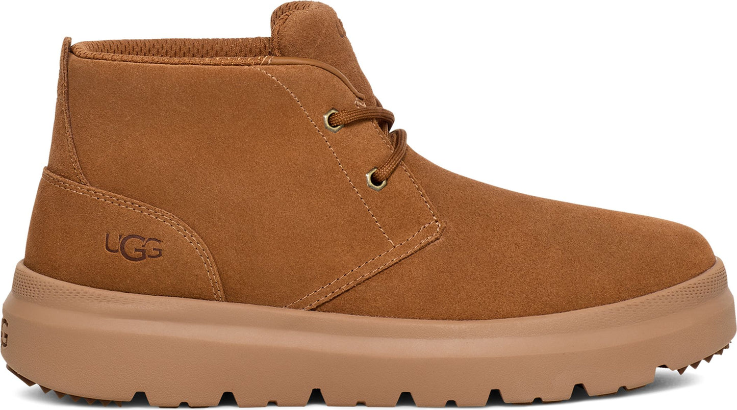 Low cut brown suede shoe with visible UGG logo and matching sole.