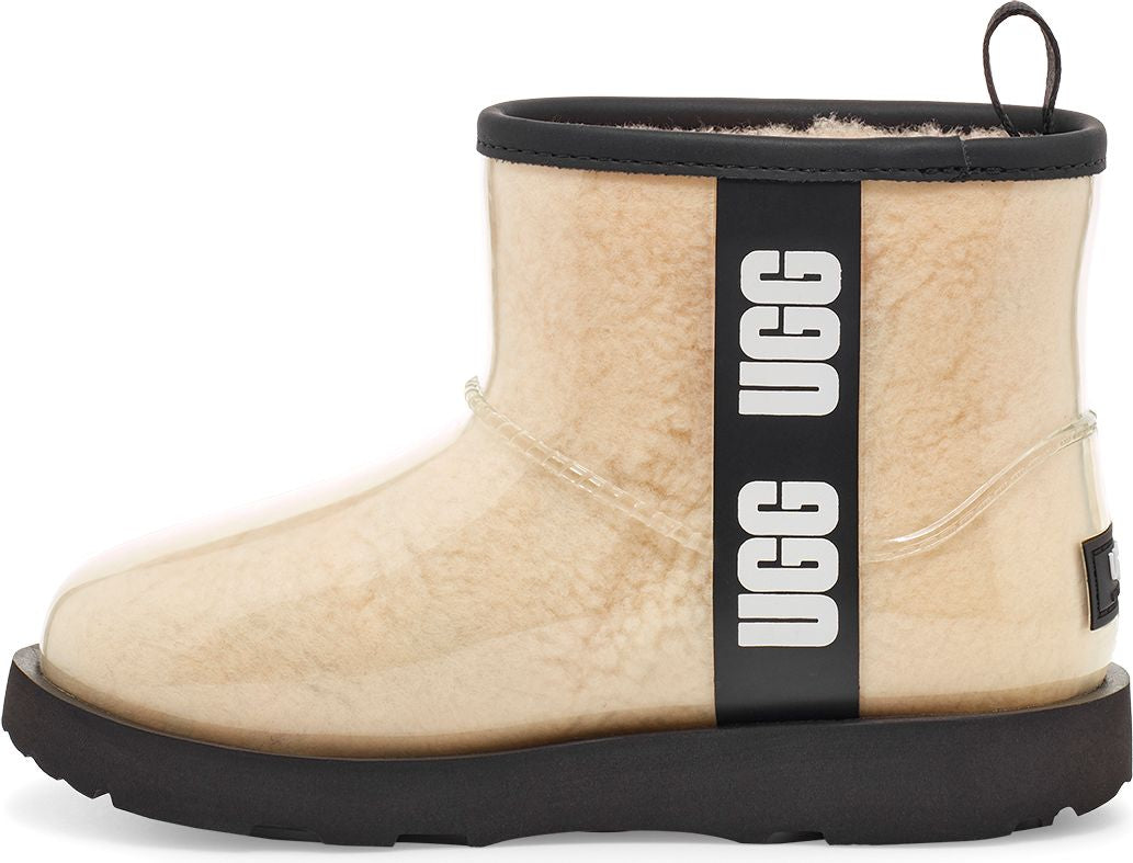 Ankle boot with a clear shell, black sole, and a vertical stripe with UGG written on it.