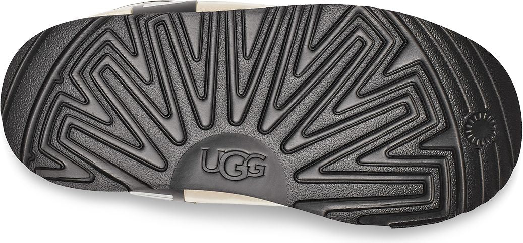 Black shoe sole with UGG logo.
