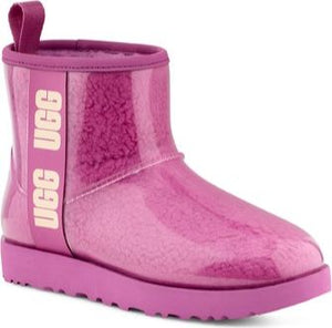 Bright pink short boot with see-through vinyl exterior, matching sole, and UGG logo on the shaft.