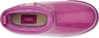 Top view of a glossy, pink, short boot with a visible UGG logo on the inner sole.