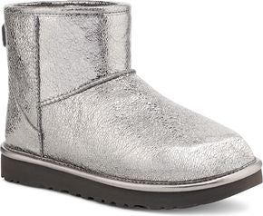 Silver ankle-high boot with dark sole.