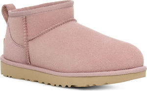 Dusty rose UGG bootie with a light-brown, lugged sole and a loop at the back.