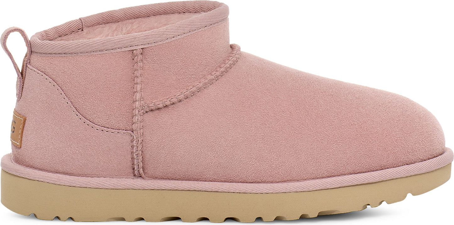 Rose-pink ankle-height UGG boot with a beige sole.