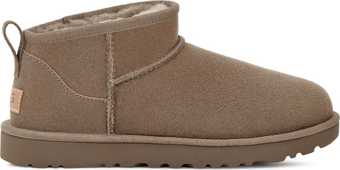 A tan suede ankle boot with a loop at the back of the ankle.