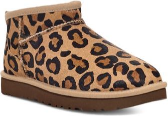 Leopard print ankle boot with tan trim and a dark brown sole.