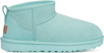 Aqua suede ankle boot with a pull tab on the back.