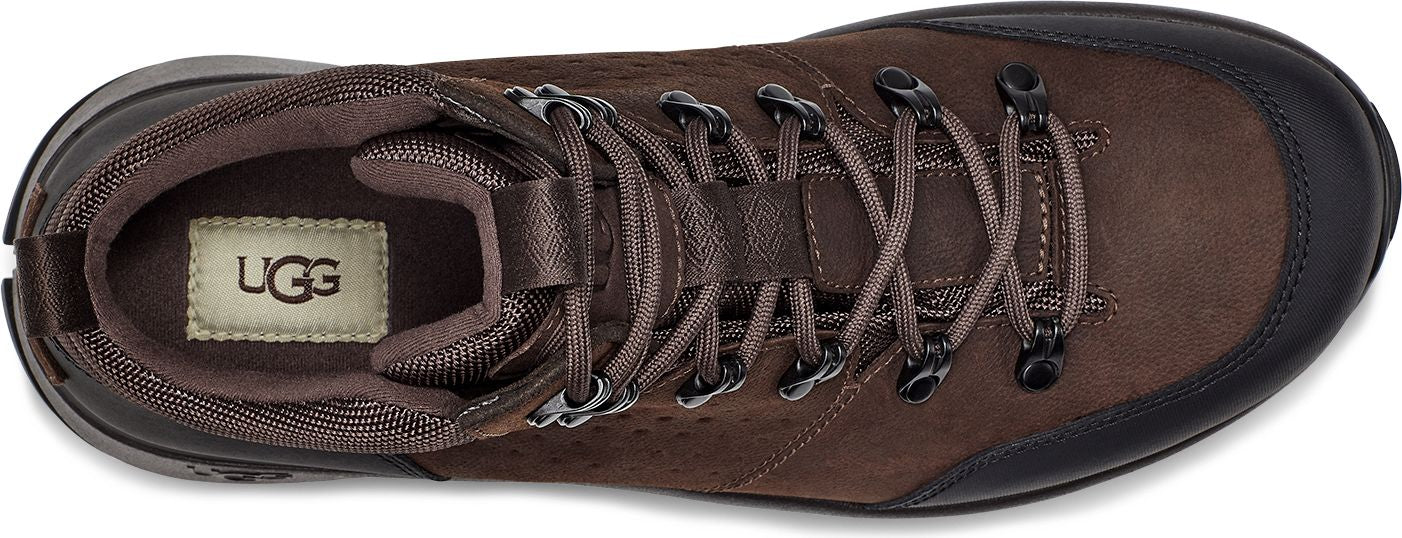 A brown lace-up boot with black rubber toe and heel.