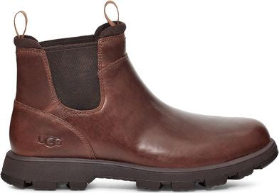 Dark brown leather ankle boot with elastic side panels and dark brown rubber sole, featuring pull loops on front and back.