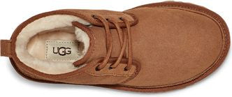 A high angle view of a tan UGG lace-up boot with sheepskin lining.