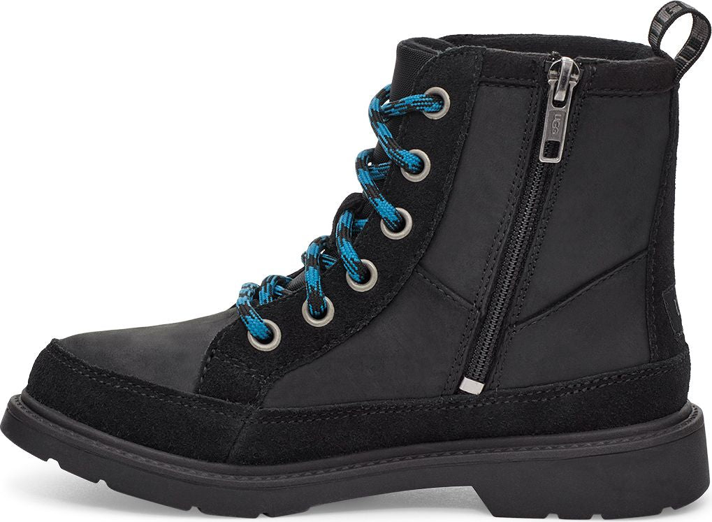 A black ankle boot with black suede accents on the toe and heel. It has blue and black patterned laces through metal eyelets and a zipper on the side.