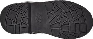 The sole of a black shoe with a textured tread pattern.
