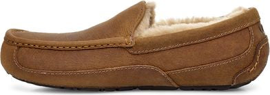 A brown leather moccasin slipper with a tan sheepskin lining.