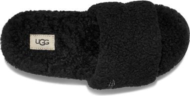 Black slipper with UGG label and a plush texture.