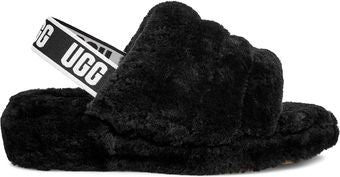Black fluffy slide sandal with an elastic back strap that reads "UGG".