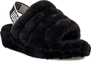 Black, plush, open-toed slipper with a strap displaying the letters 'UGG'.
