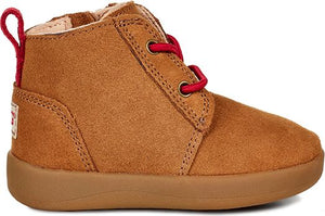 A child-sized brown suede ankle boot with red laces and a red pull tab.