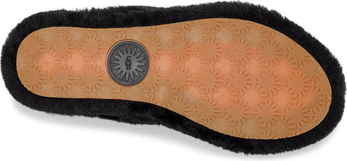 Bottom of a black, fluffy slipper with a tan sole and a UGG logo.