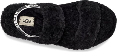 Black furry slide with white strap bearing "UGG".