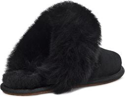 Black slipper with furry trim.