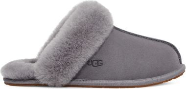 A gray slipper with fur lining and UGG logo.