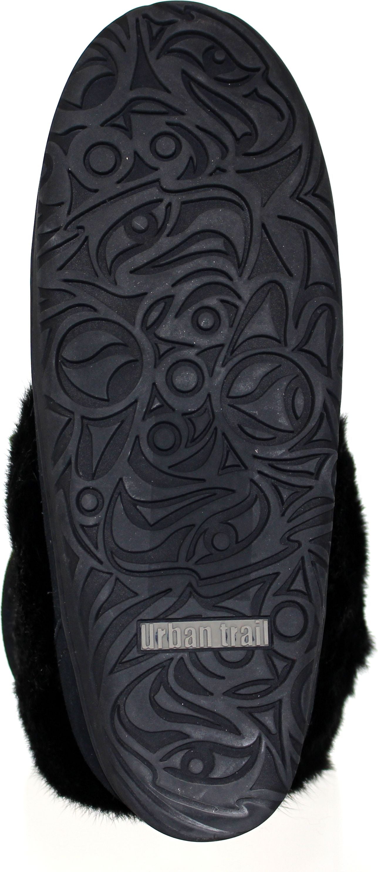 The sole of a black slipper with a textured, patterned tread.