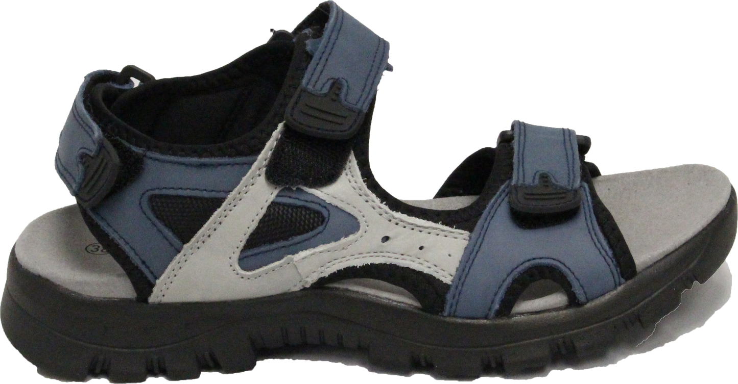 Side view of a blue, black and white sandal with velcro straps and a thick black sole.