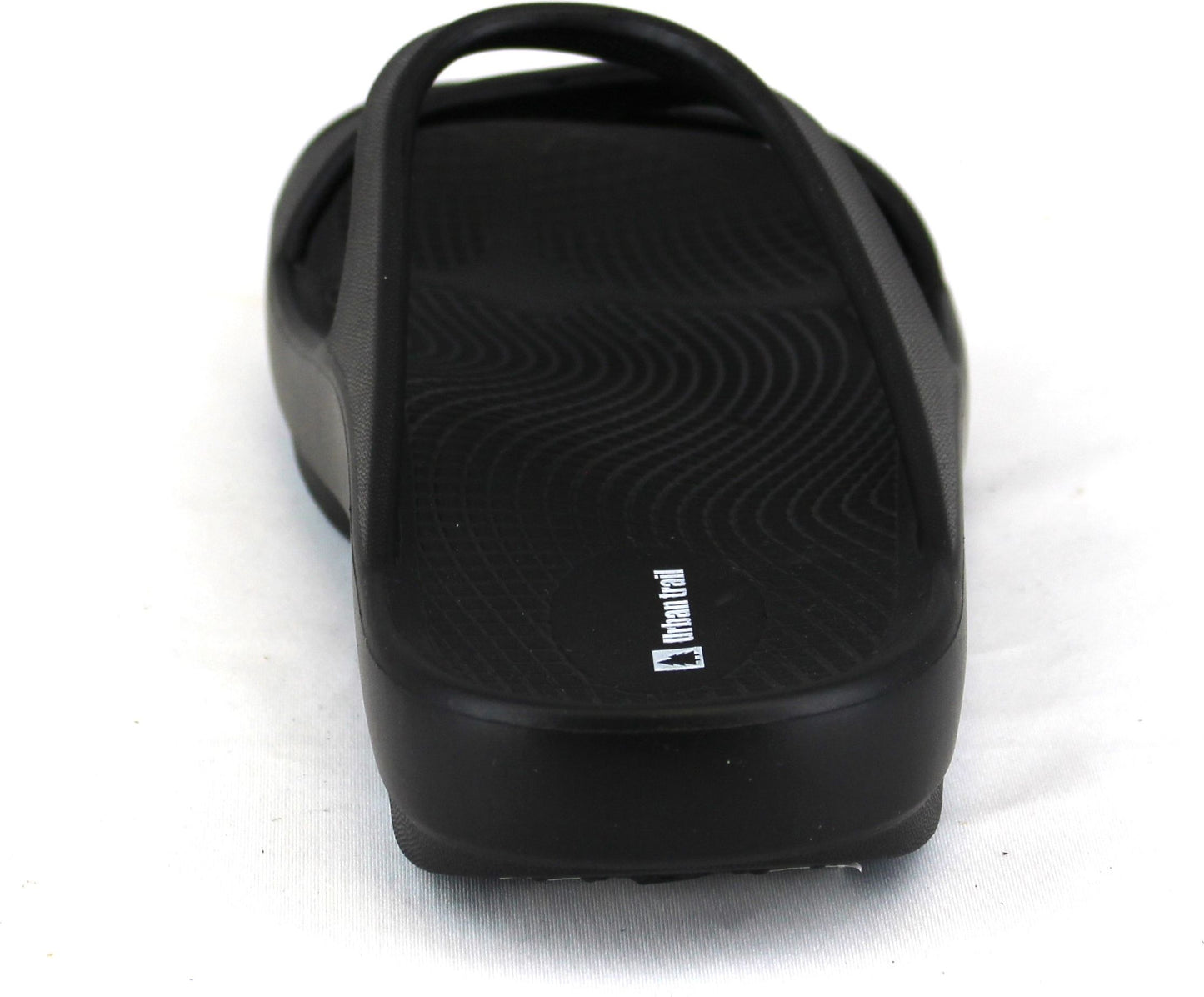 Black slide sandal with crossed top straps and visible white logo on the side.