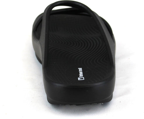 Black slide sandal with crossed top straps and visible white logo on the side.