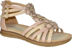 Light pink and beige sandal with flower embellishments and three adjustable gold buckles on the side.