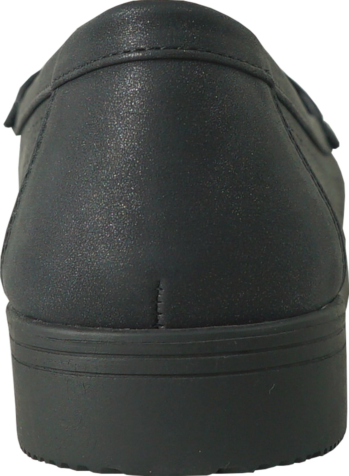 Close-up of a black shoe from the back, showing a low heel and smooth, slightly textured material.