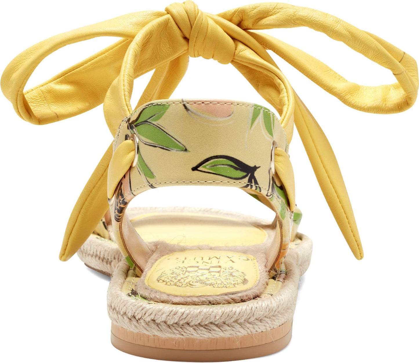 Yellow sandals with ankle tie straps and floral pattern.