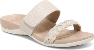 Cream sandal with hook and loop strap over the arch and a braided toe strap.