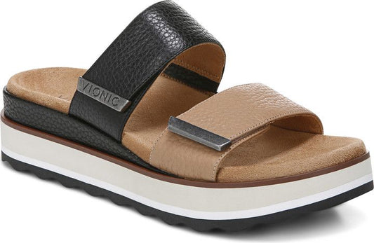 Sandals with black and tan leather straps, a white platform, and the word VIONIC visible on the side.