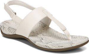White sandal with t-strap, ankle strap, and snakeskin patterned insole.