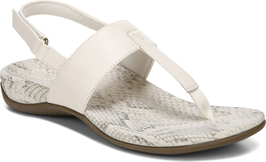 White sandal with t-strap, ankle strap, and snakeskin patterned insole.