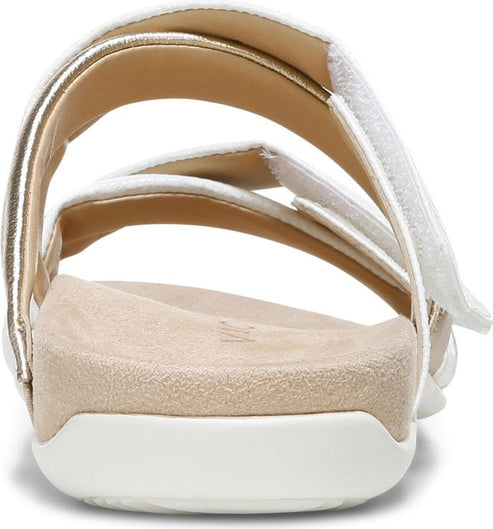 Back of a white sandal with two hook and loop straps.
