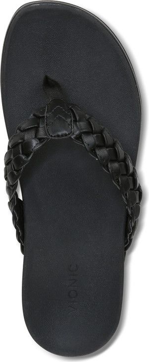 A close-up of a black woven sandal.