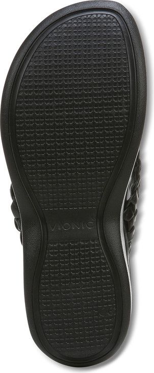 Black flip flop sole with a textured pattern and the word Vionic visible.