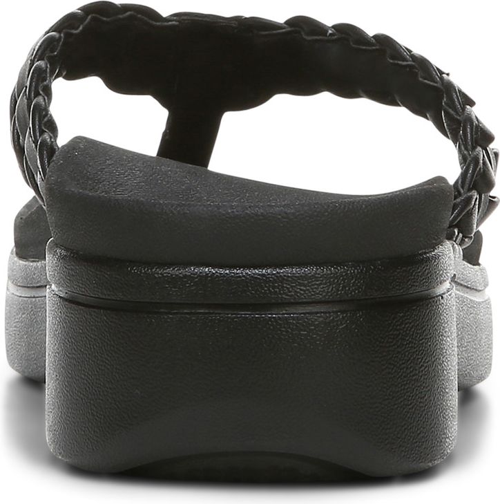 Back of a black sandal with braided strap and platform sole.