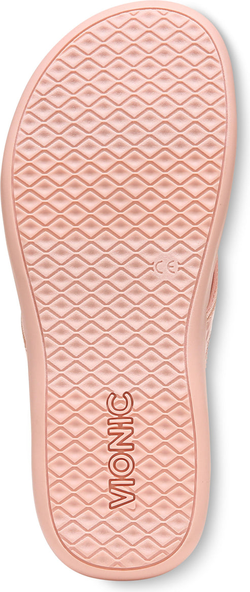 Peach colored shoe sole with a geometric pattern and the word "VIONIC" written on the bottom.