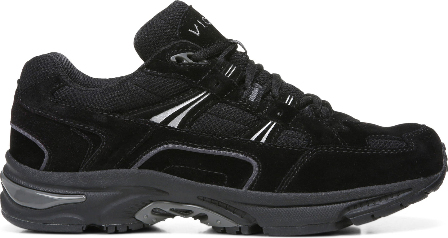Black suede and mesh walking shoe with black sole and side stripes.