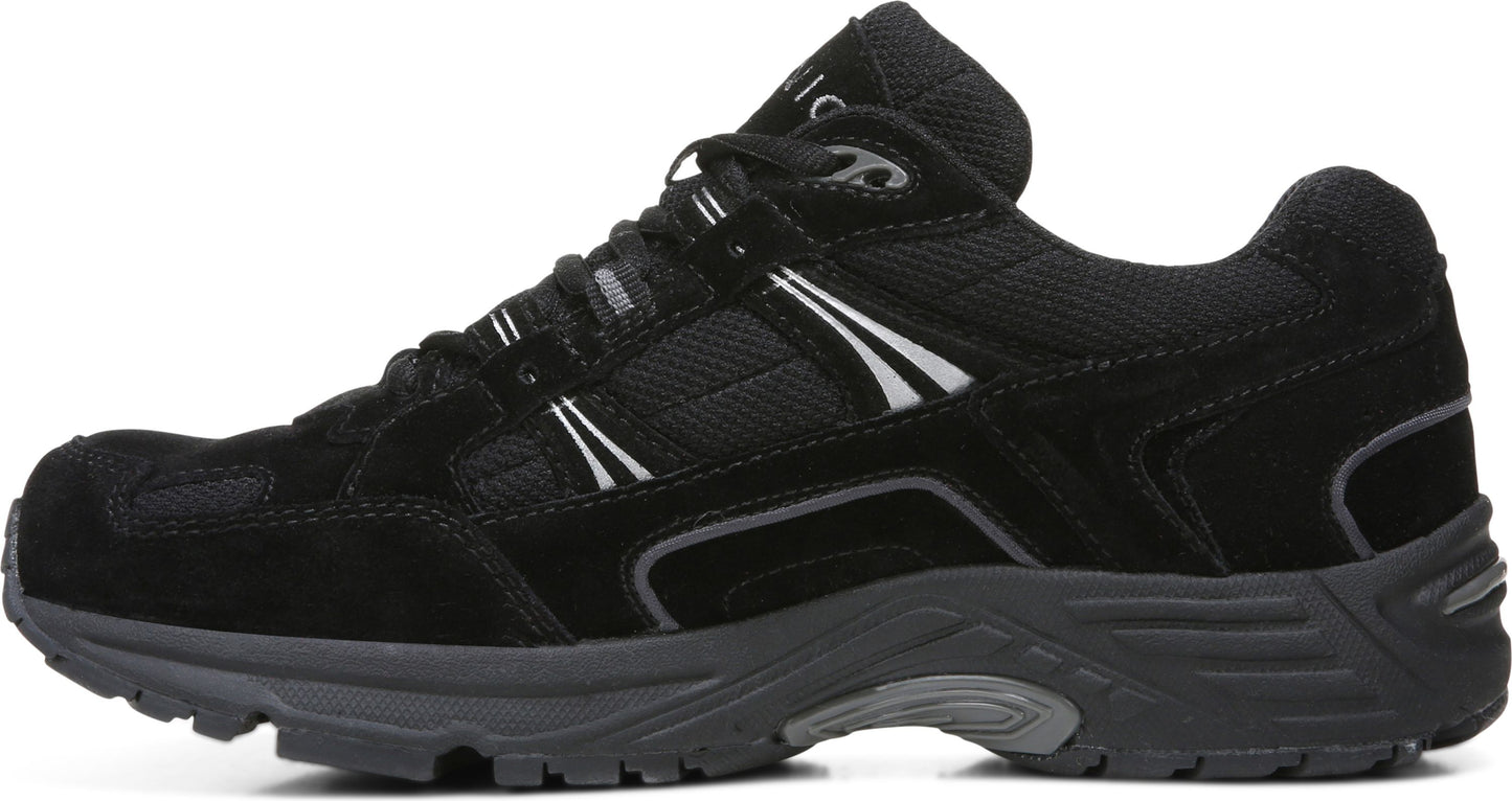 A black athletic shoe with suede and mesh upper, a gray sole, and white accents.