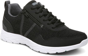 Black sneaker with side zipper and white sole.
