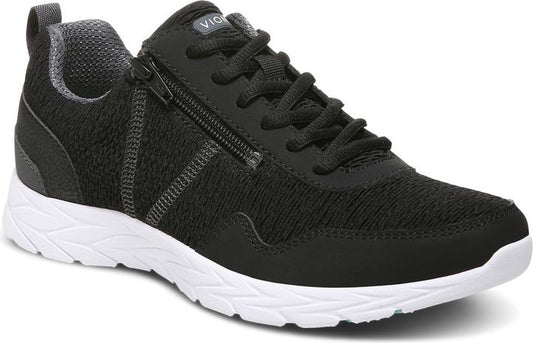 Black sneaker with side zipper and white sole.