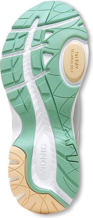 Shoe sole with green, white, and tan tread patterns.