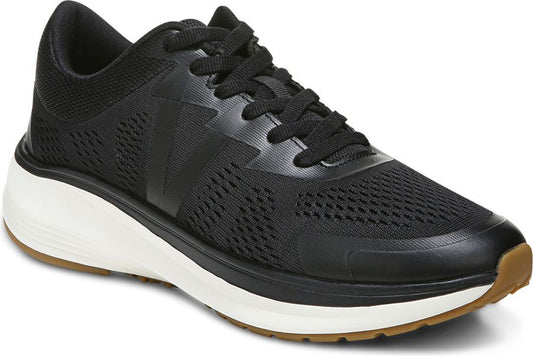 Black athletic shoe with black laces, mesh upper, and a thick white sole.